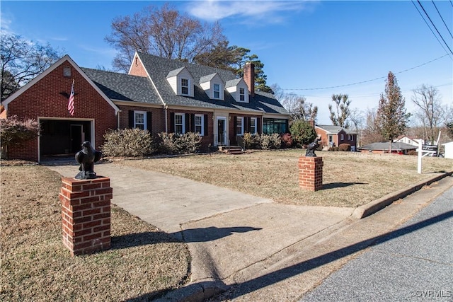 cape cod house with a front lawn