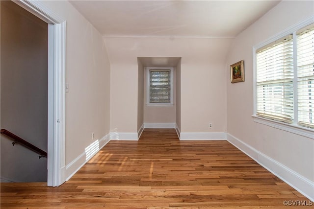 spare room with light hardwood / wood-style floors