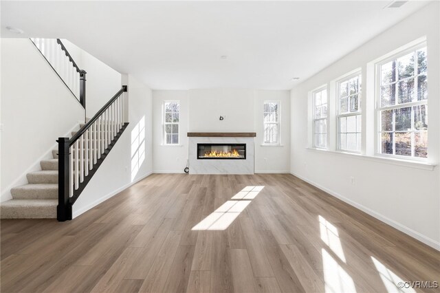 unfurnished living room featuring light hardwood / wood-style flooring