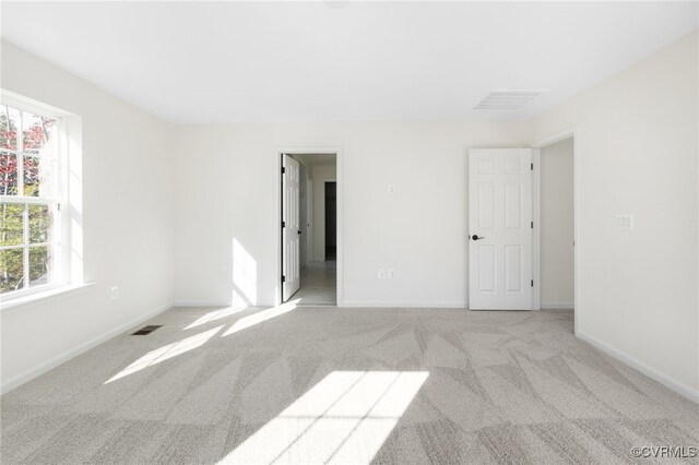 empty room featuring light colored carpet