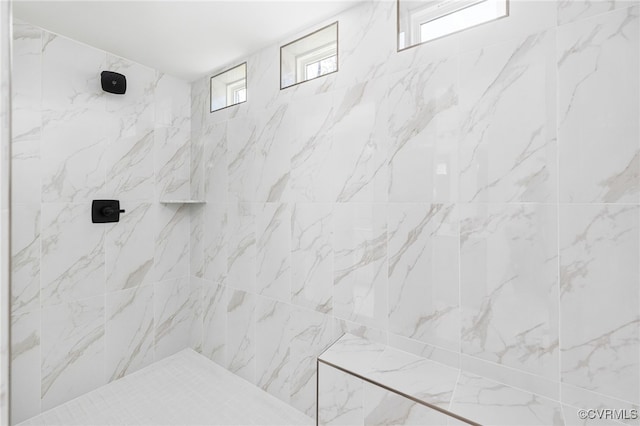 bathroom featuring tiled shower