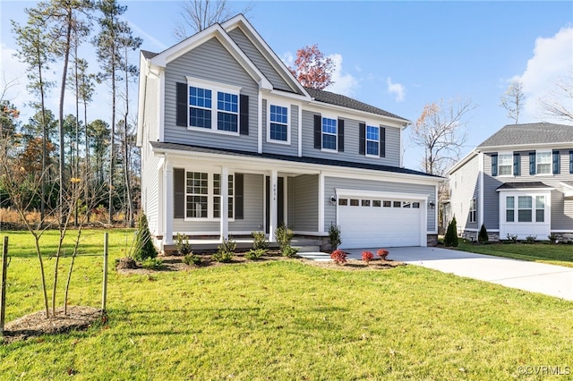 view of front of house featuring covered porch, a garage, and a front yard