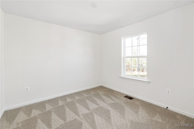 empty room featuring carpet floors