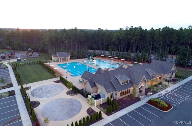 view of pool with a yard