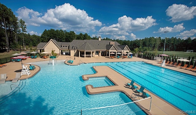 view of swimming pool with a patio area