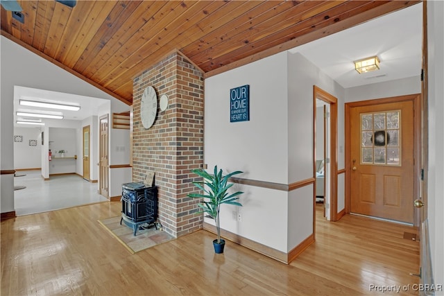 hallway with wooden ceiling, lofted ceiling, and light wood-type flooring