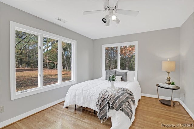 bedroom featuring hardwood / wood-style floors and ceiling fan