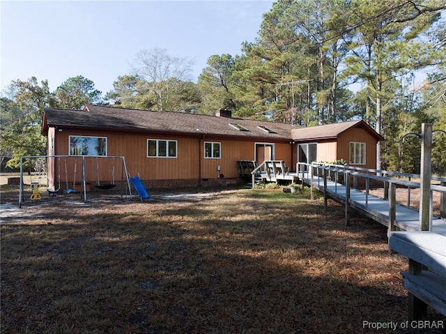 back of house featuring a deck