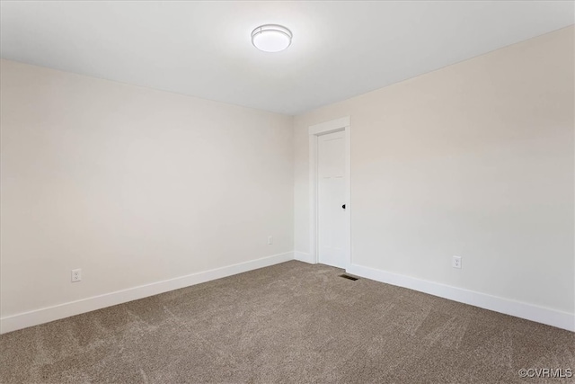 unfurnished room featuring carpet