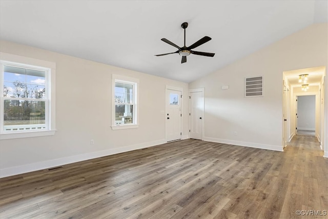 unfurnished living room with hardwood / wood-style flooring, ceiling fan, and lofted ceiling