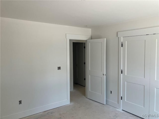 14310 Meadow Ln, Disputanta, VA 23842 - unfurnished bedroom featuring baseboards and unfinished concrete flooring