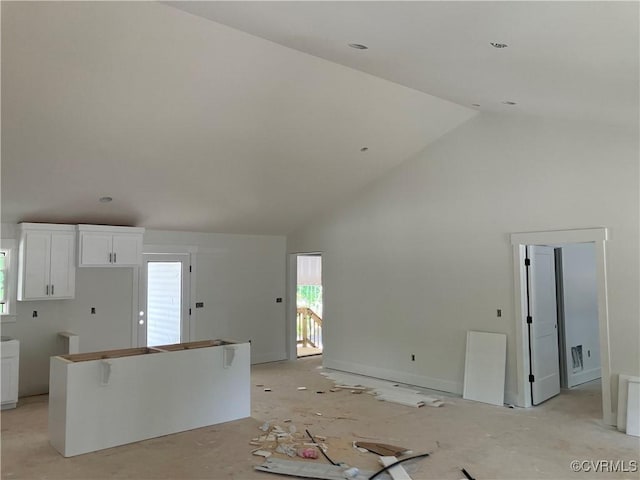 14310 Meadow Ln, Disputanta, VA 23842 - unfurnished living room featuring high vaulted ceiling and plenty of natural light