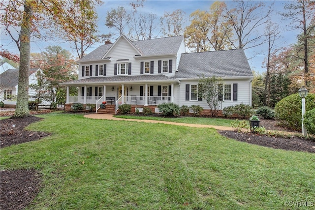 view of front of home featuring covered porch and a front lawn