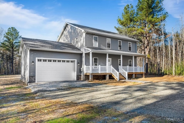 view of front of house featuring covered porch and a garage