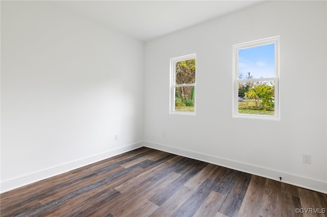 unfurnished room featuring dark hardwood / wood-style flooring