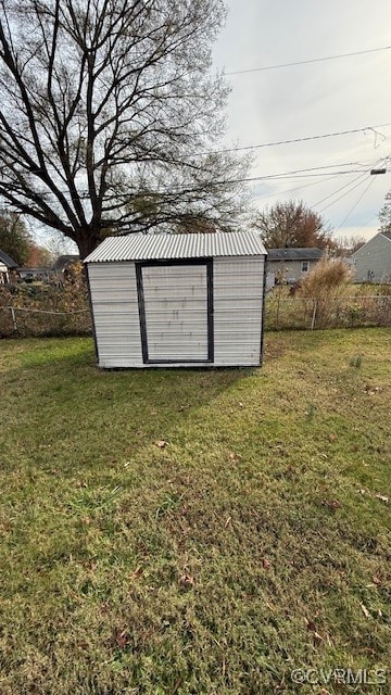 view of outbuilding with a lawn