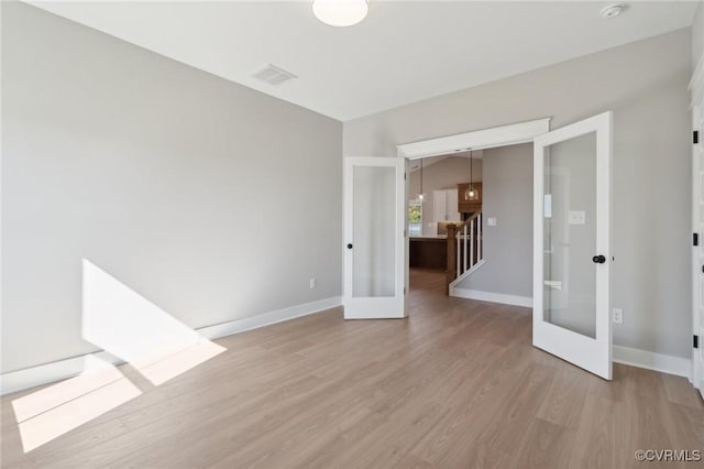 TBD2 Rocky Ford Rd, Beaverdam, VA 23015 - empty room featuring french doors, baseboards, visible vents, and light wood finished floors