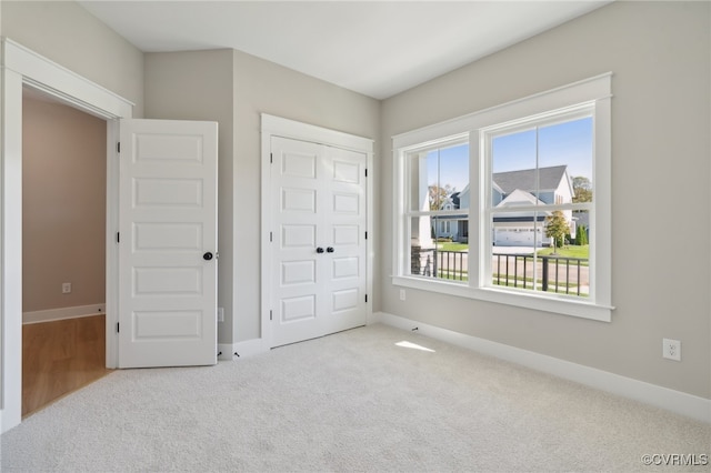 carpeted bedroom with a closet