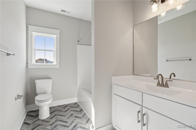 full bathroom featuring vanity, toilet, and washtub / shower combination