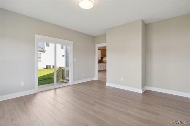 unfurnished room featuring light hardwood / wood-style floors