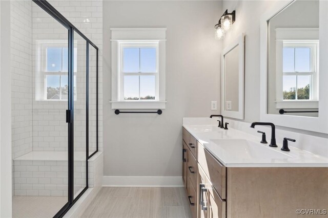 bathroom featuring vanity and walk in shower