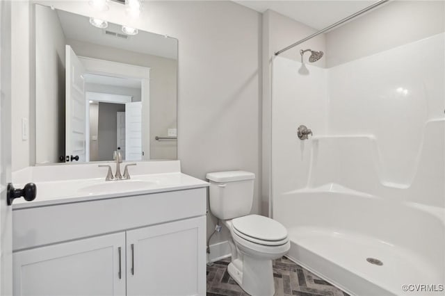 TBD2 Rocky Ford Rd, Beaverdam, VA 23015 - full bathroom featuring visible vents, baseboards, toilet, vanity, and a shower