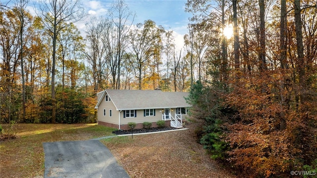 view of front of property with a front yard and a porch