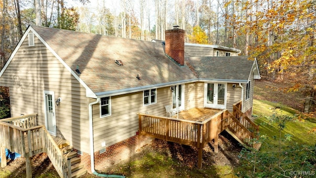 back of property featuring a wooden deck and french doors