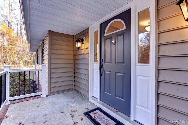 entrance to property featuring a porch