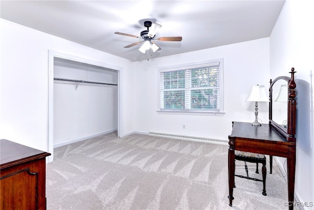 bedroom with ceiling fan, a baseboard radiator, a closet, and light carpet