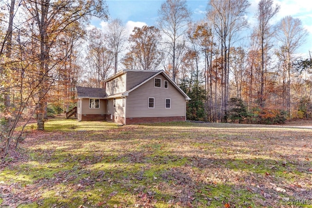 view of home's exterior featuring a lawn