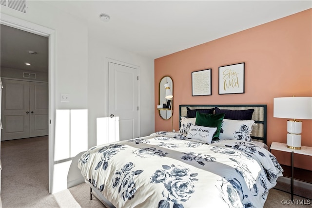 carpeted bedroom featuring a closet