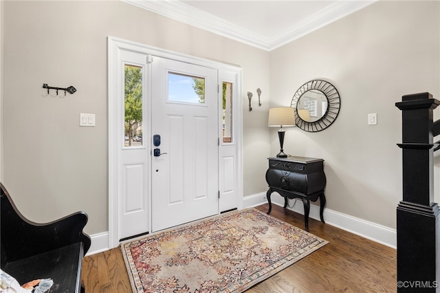 foyer entrance featuring dark hardwood / wood-style flooring and ornamental molding