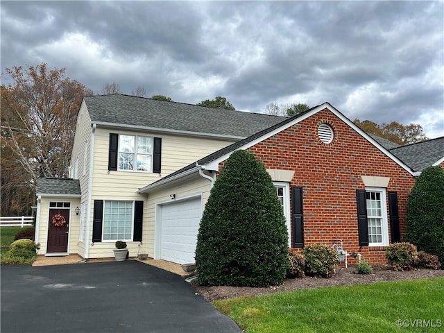 front of property with a garage