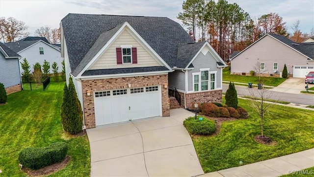 view of front of property with a front yard and a garage