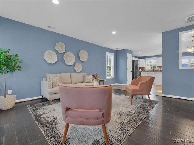 living room with dark wood-type flooring