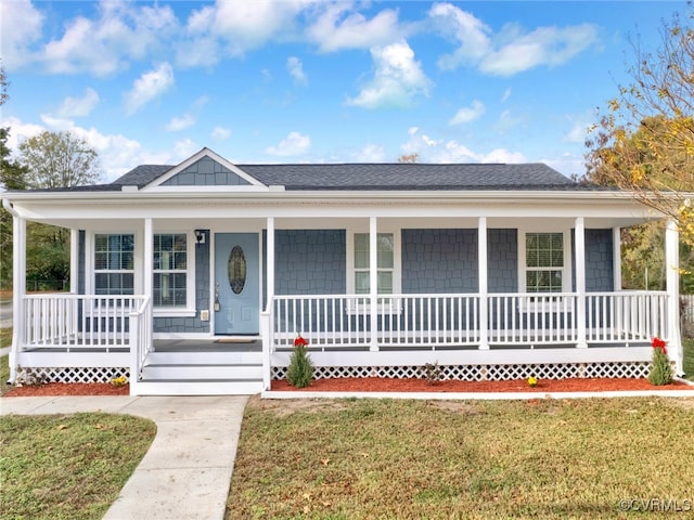 single story home with a porch and a front yard