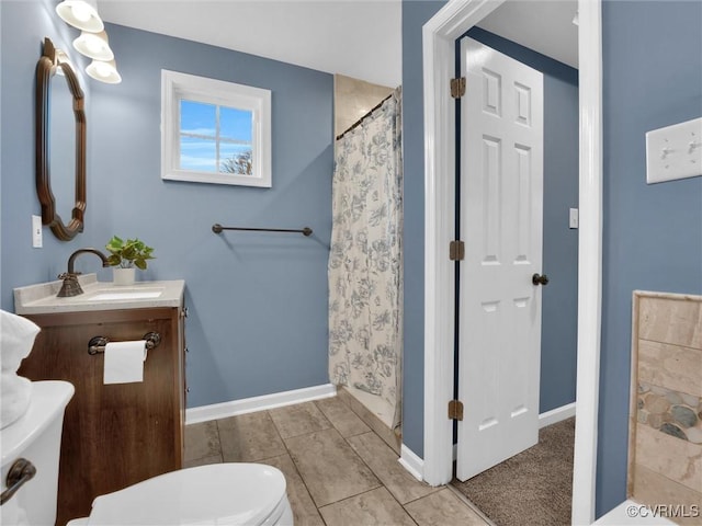 bathroom featuring vanity, a shower with curtain, and toilet