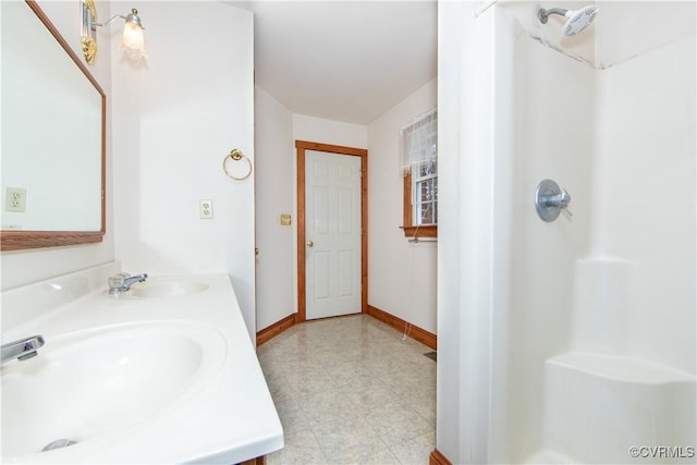 bathroom featuring vanity and walk in shower