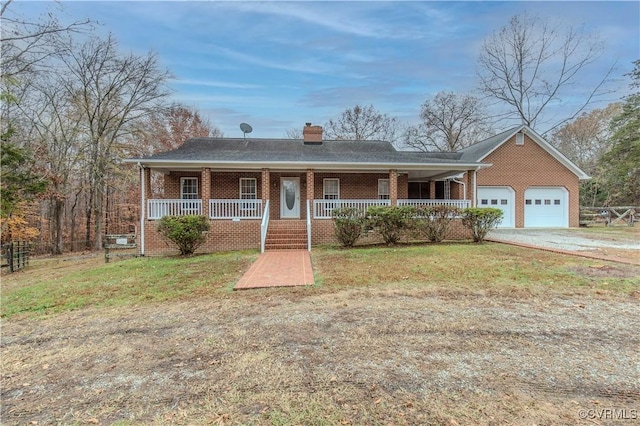 ranch-style house with a porch and a garage