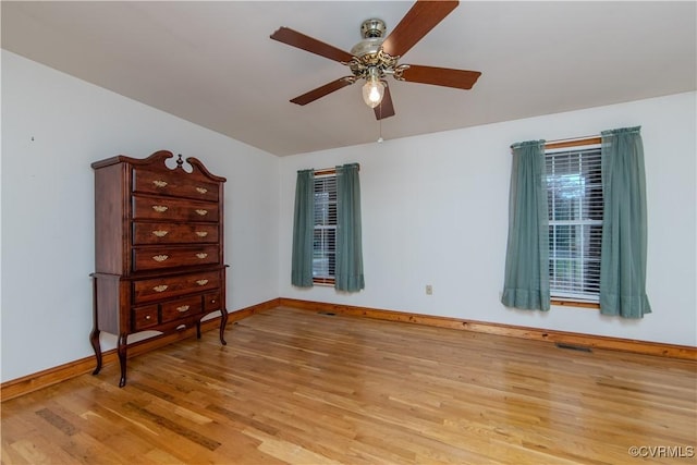 bedroom with light wood-type flooring and ceiling fan