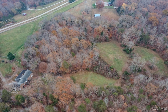 birds eye view of property with a rural view