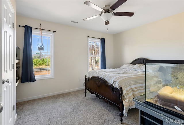 carpeted bedroom featuring ceiling fan