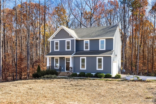 front of property featuring a garage and covered porch