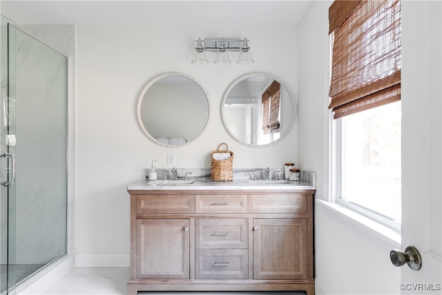 bathroom with vanity, tile patterned floors, and a shower with door