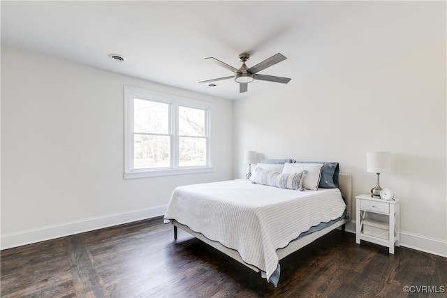 bedroom featuring ceiling fan and dark hardwood / wood-style floors