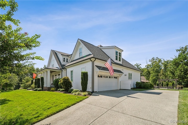 view of front facade featuring a front yard and a garage