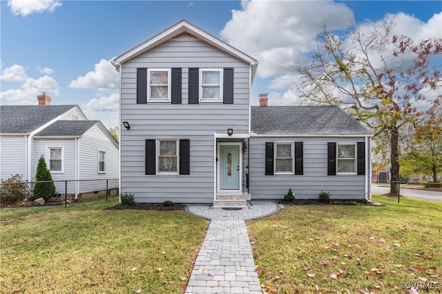 view of front property with a front lawn