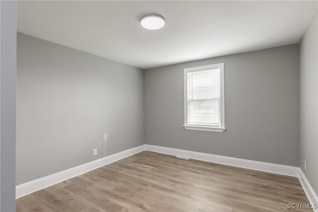 spare room featuring light hardwood / wood-style flooring