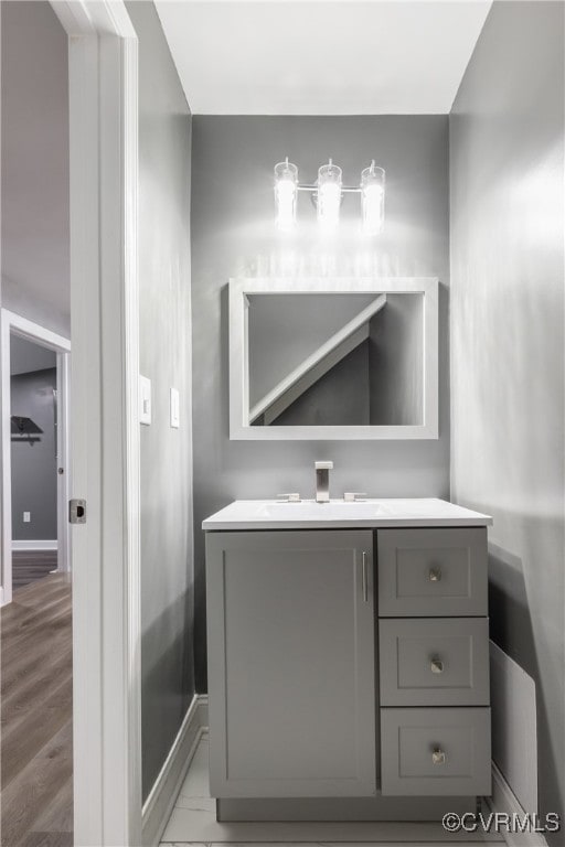 bathroom with vanity and wood-type flooring